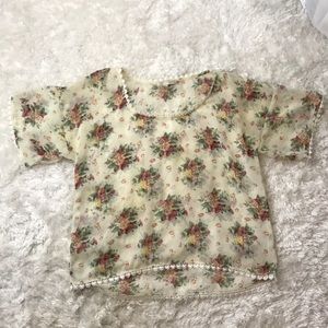 Small sheer floral blouse.
